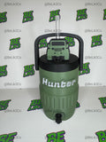 May include: An olive green insulated beverage cooler with a black handle and lid. The cooler features a clear straw, a small olive green off-road vehicle emblem on the lid, and the name Hunter in white lettering on the front side of the cooler.